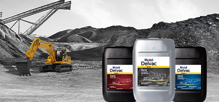 Bidons Mobil Delvac Ultra, Modern et Legend avec un tracteur dans une ferme