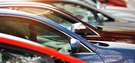 red blue brown cars row