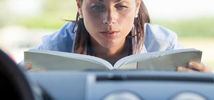 woman reading manual